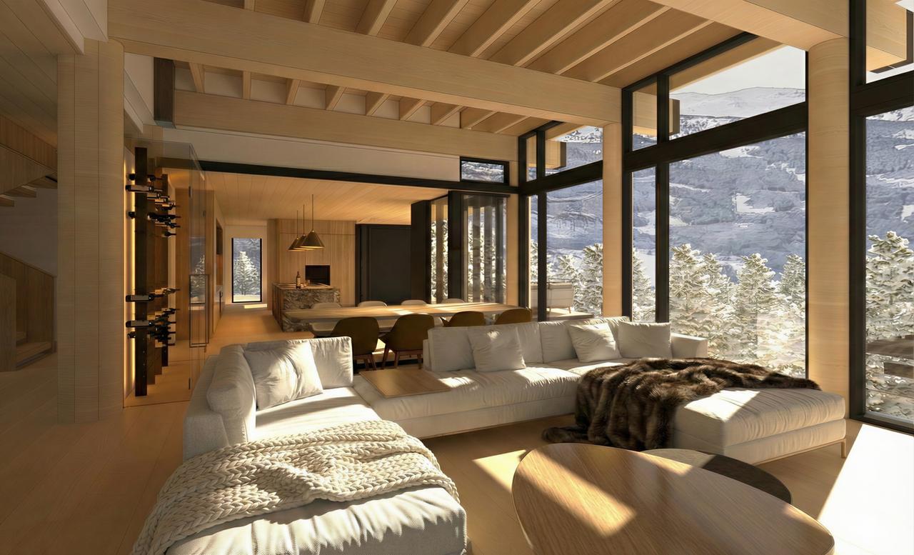 Living room with white sectional and mountain view through floor-to-ceiling windows